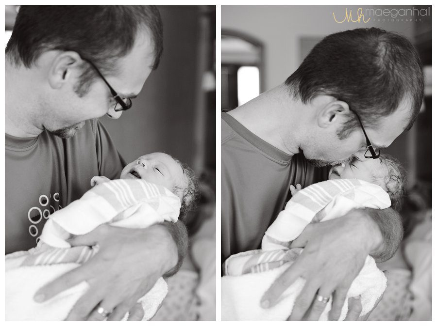 newborn baby smile daddy kiss hospital